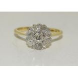 An Art Deco Diamond 18ct gold and Platinum cluster ring, Size N. (Ref WP)