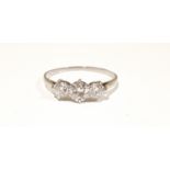 Three stone 1ct diamond trilogy ring in white metal, size T. (Ref WP)