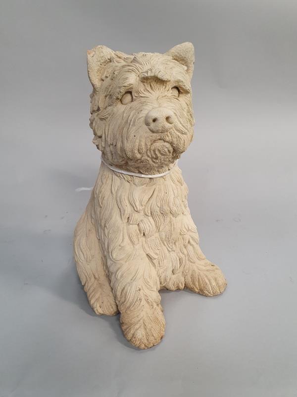 A concrete garden ornament of a terrier dog (Ref WP)