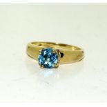 A 9ct gold ladies blue stone solitaire ring, Size P (Ref WP)