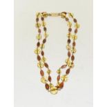 A Citrine/Goldstone necklace set in 9ct gold. (Ref WP)