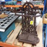 A cast iron vintage style umbrella stand. (Ref WP)