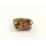 Silver ring with orange coloured stone. Size O. (Ref WP)