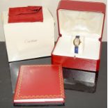 A ladies 18ct gold Cartier watch, Model 1954, boxed and papers, purchased new may 2000(These have