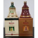 Two Bell's Whisky Wade decanters to include Christmas 1998 and Christmas 1999. Both boxed and