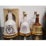 A collection of six Bells whisky Wade decanter all sealed to include birth of Prince William 1982,