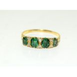 An 18ct gold ladies vintage set emerald and diamond ring, Size Q (W3).