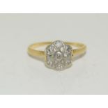 An 18ct diamond Art Deco daisy ring, size K 1/2. (Ref WP)