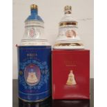 Two Bell's Whisky Wade decanters to include Queen Mother 90th Birthday 1990 and Christmas 2000. Both