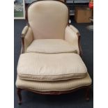 Walnut fireside chair with matching footstool.