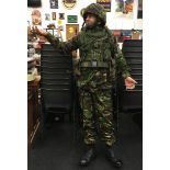 A military dressed camouflaged mannequin.