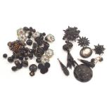 A quantity of good quality Jet (Possibly Whitby or French) to include buttons earrings and a cameo.