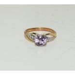 A 9ct gold diamond and amethyst ring, Size J