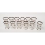 A set of six red and six white Italian embossed and engraved wine glasses with silver decoration.