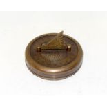 A brass cased sundial and compass.