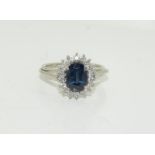 An 18ct white gold ladies Diamond and Sapphire ring, approx 2ct sapphire, Size K.