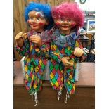 A pair of vintage animatronic clowns by H.J. Figurer.