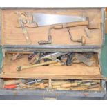 A vintage carpenters wooden tool chest complete with a large quantity of vintage woodworking tools