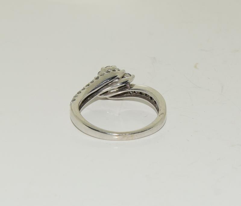 A Diamond cluster twist and diamond shoulder ring on white gold size L. - Image 3 of 3