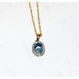 An 18ct yellow gold Aquamarine and diamond pendant necklace, 55points.