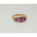 A vintage Ruby trilogy and diamonds on 9ct gold Size L