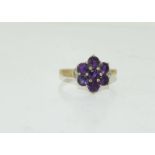 A 9ct gold ladies Amethyst and Diamond cluster ring.