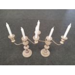 A pair of vintage silver plated three arm candelabras.