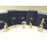 Swarovski Crystal: globe 199455, inkwell 189195, microscope 272878, guitar V2 665051, sail boat