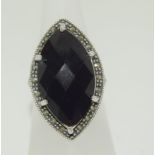 A large black onyx marcasite silver ring, size P 1/2.