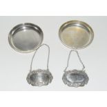 Pair of silver hallmark drip trays and the pair of silver h/m decanter labels