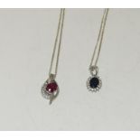 Two ruby and sapphire 925 silver pendants.