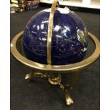 Modern globe on stand with compass to base.