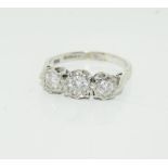 An 18ct white gold ladies three stone diamond ring, approx 1ct, size O.