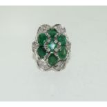 5.6ct Emerald and 0.9ct of Diamonds (VSI G) on gold and silver. Size M.