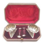 Pair of silver salts and spoons (unmarked) boxed.