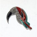 An unusual silver and enamel toucan brooch.