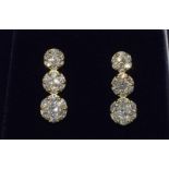 A pair of 18ct gold graduated three panel drop earrings of 1.2ct's.