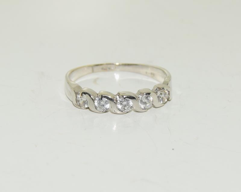 A Hallmarked five stone ring on 9ct white gold Size M +