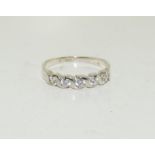 A Hallmarked five stone ring on 9ct white gold Size M +
