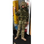 A full battle camouflage army mannequin.