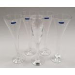 A set of four Marquis by Waterford fluted drinking glasses together with another by John Rocha at