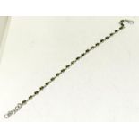 A green drop side 925 silver line bracelet.