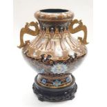 Chinese Cloisonne large two handled vase with carved hardwood stand.