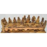 A religious carved wooden icon of the last supper possibly in palm wood