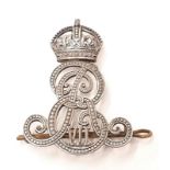 A silver VII cap badge