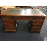 Reproduction leather top mahogany pedestal desk.
