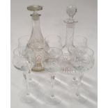 A collection of six glasses with two decanters.