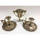 Silver h/m trophy cup together with a pair of Victorian candle night sticks.