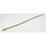 A 14ct gold ladies Tanzanite and Diamond tennis bracelet, approx 4ct Tanzanite.