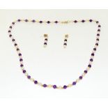 A 9ct gold amethyst and pearl necklace with matching earrings.